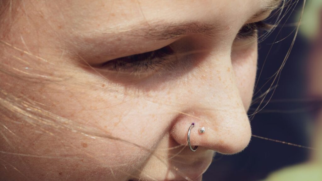 Close Up Of Nose Piercing With Small Hoop Ring 