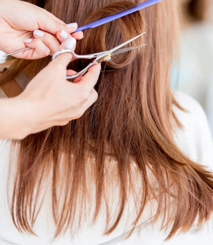 Hair Stylist Cutting Long Brown Hair