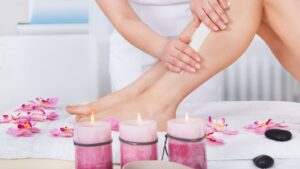 Woman Waxing Her Leg at a Spa